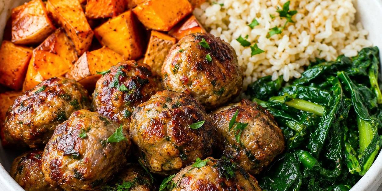 Herbed turkey meatballs with roasted sweet potato, brown rice and greens